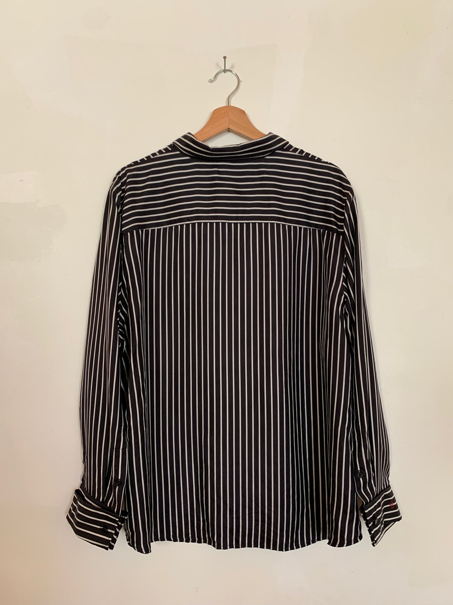 Long-sleeved silk button-up blouse